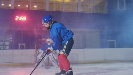 Hockey-player-carries-out-an-attack-on-the-opponent's-goal-and-scores-a-goal-in-extra-time.-The-player-brings-victory-to-his-team-in-shootouts